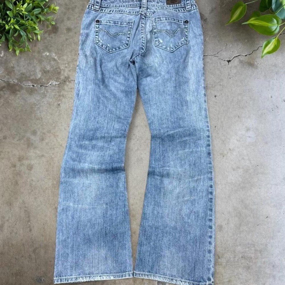 Light wash low rise flare jeans with a relaxed fit